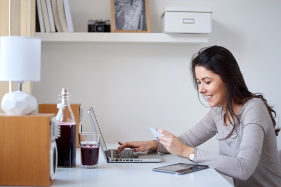 Is HELOC Interest Tax Deductible? Woman working on laptop