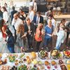 party goers gathering around the buffet table