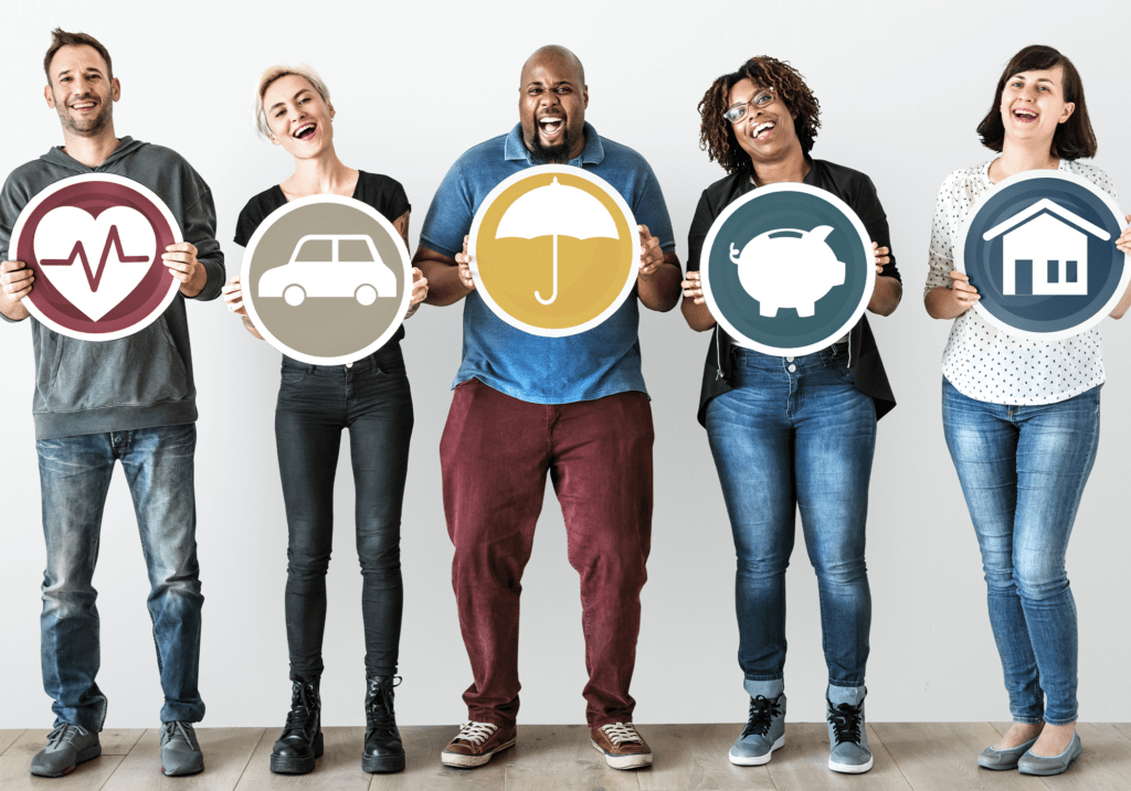 Five people celebrating financial empowerment by holding up icons of common financial goals. 