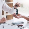 man receiving car keyus after getting answer to can i use heloc to buy a car
