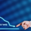Graphic showing dropping interest rates and mortgage rates