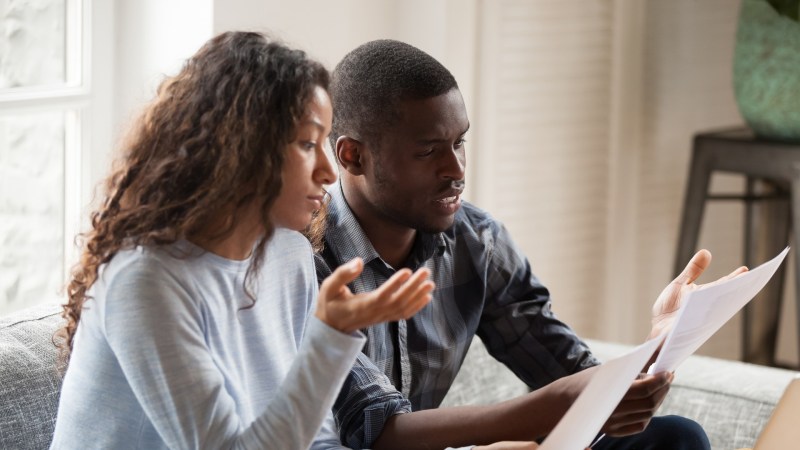 Couple learning what is consumer debt