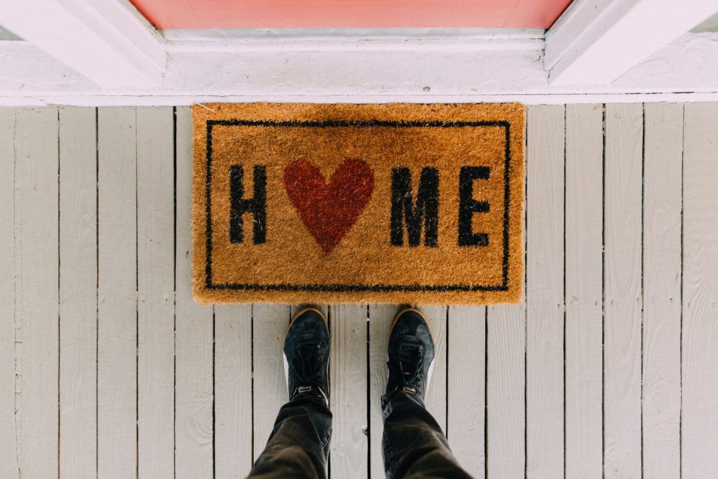 Person standing at front door