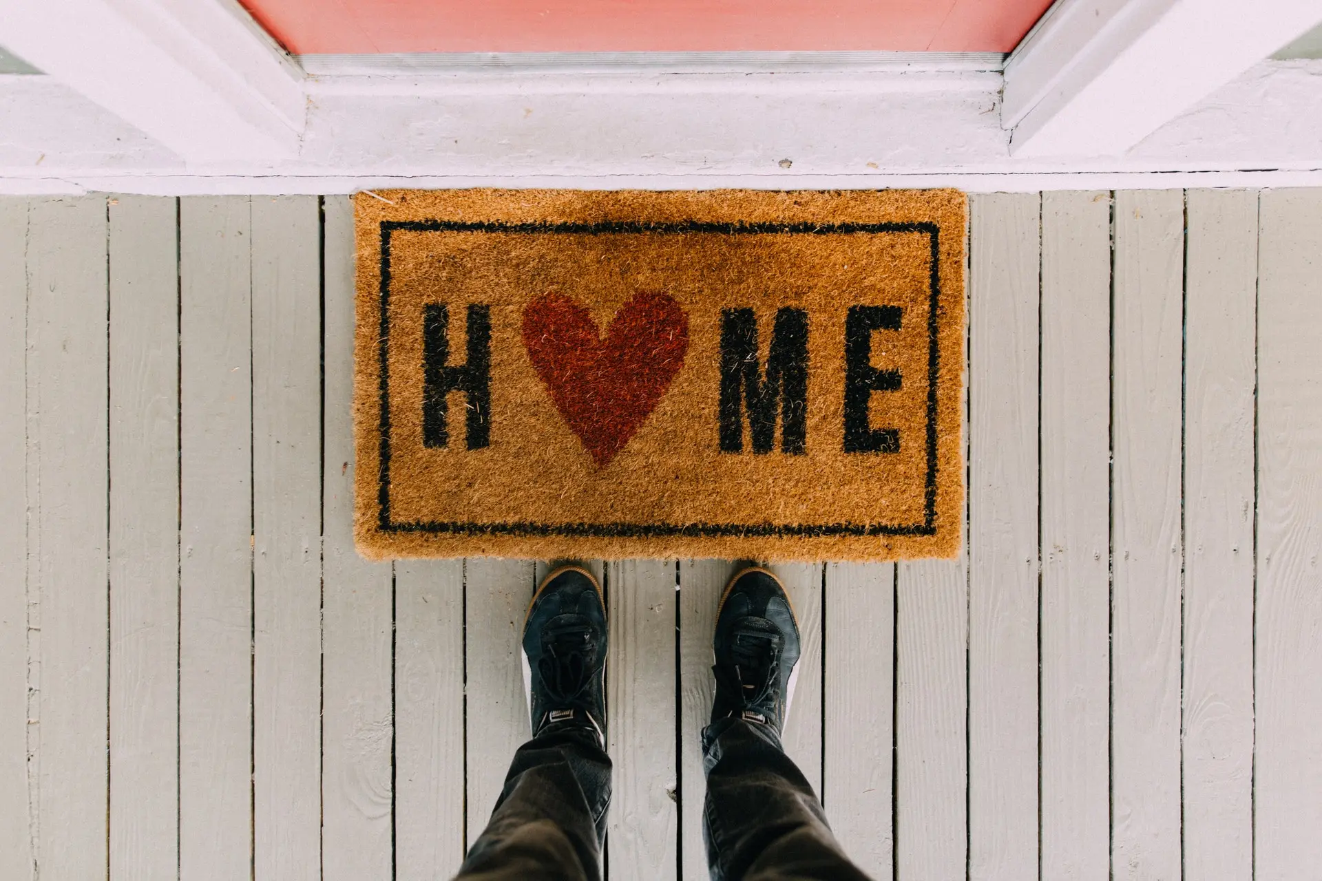 Person standing at front door 