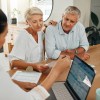 Financial advisor consulting with clients on end-of-life documents