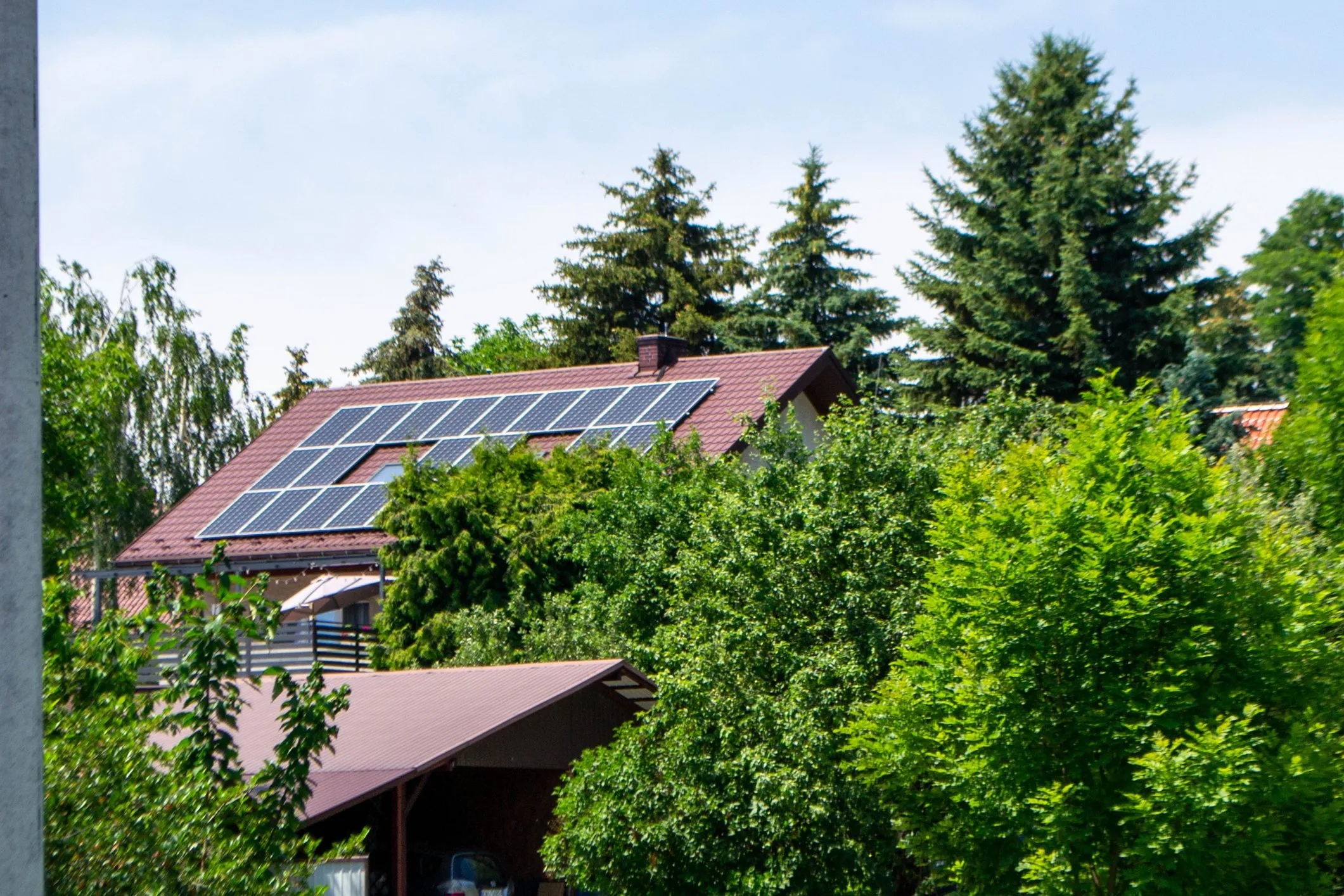 Farm house with modern solar panels on roof
