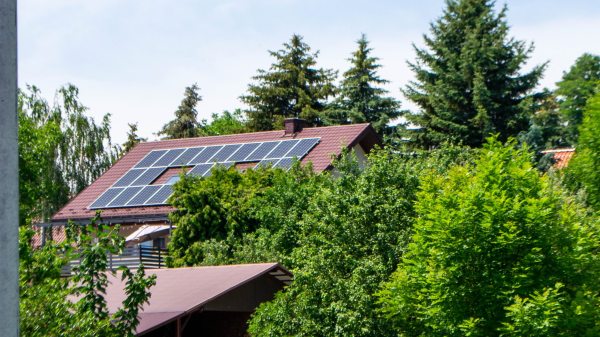 Farm house with modern solar panels on roof