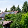 Farm house with modern solar panels on roof