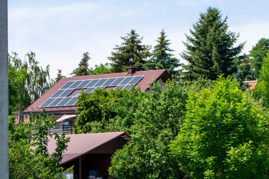 Farm house with modern solar panels on roof 