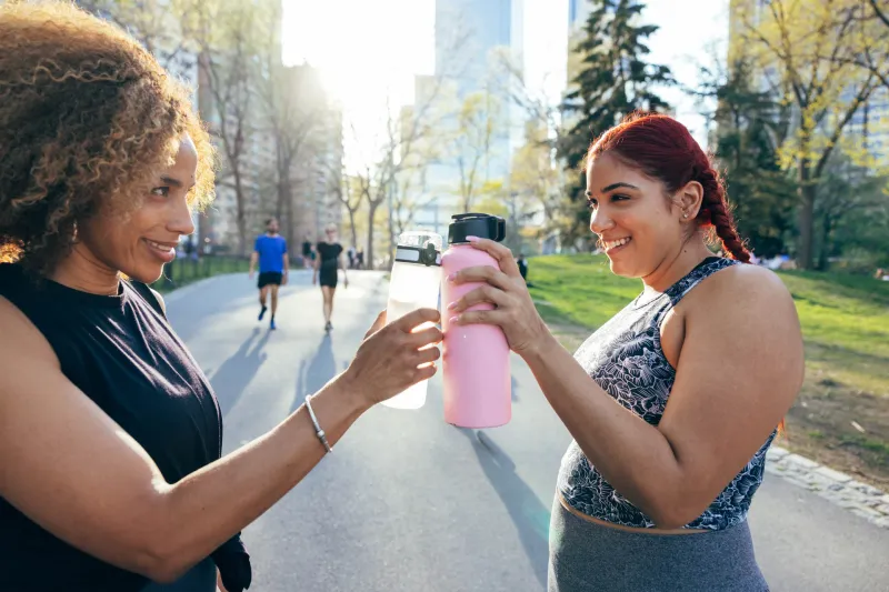 Two friends in their morning activity at the park, active lifestyle in Spring, New York, USA.