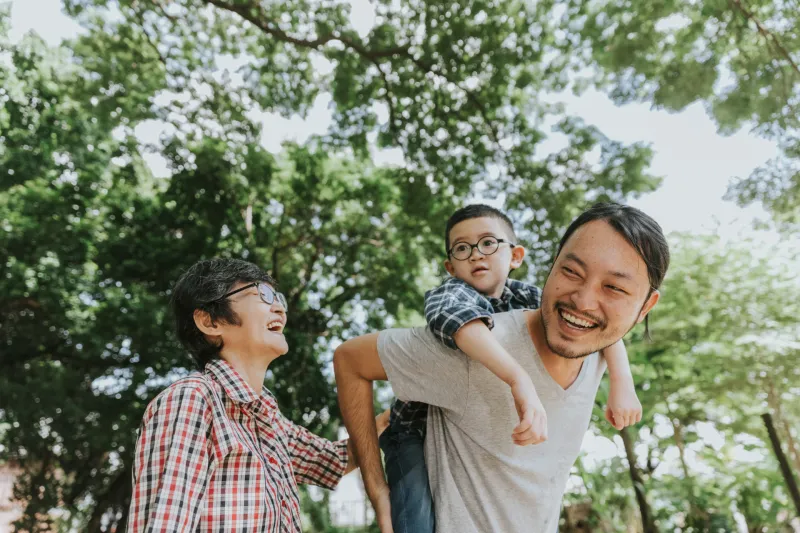 Asian family having fun at the garden